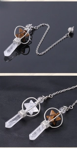 Macro shot of rotatable Merkaba pendant with tiger eye and clear quartz crystals