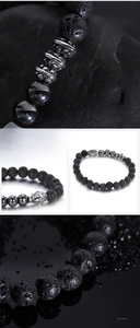 Detail view of lava rock beads and stainless steel Buddha head on men's bracelet