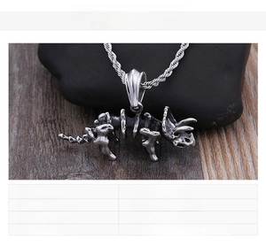 Detailed close-up of a stainless steel triceratops skeleton pendant with a twisted chain