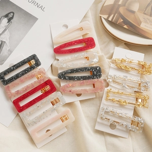 Sparkly geometric foil hair clips set in rectangle and teardrop shapes for women