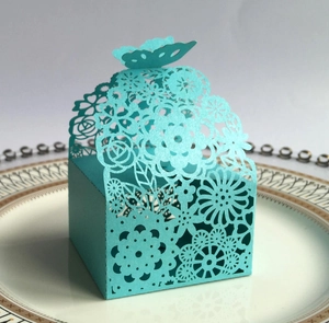 Detailed laser-cut butterfly wedding favor box with intricate floral hollow patterns