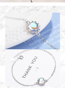 Detail of S925 sterling silver crown clasp and moonstone pendant on the elegant bracelet