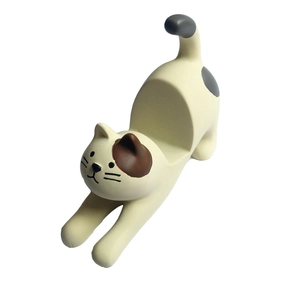Detail view of a cute resin cat phone stand showing the back slot for mobile support
