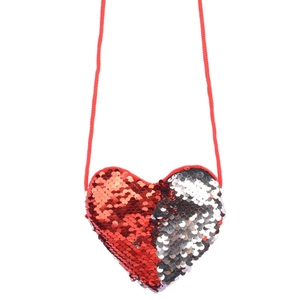 Macro detail of heart-shaped sequin mini bag with red and silver glitter surface