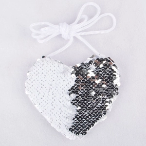 Detail of heart-shaped sequin coin purse with silver reversible sequins and braided strap