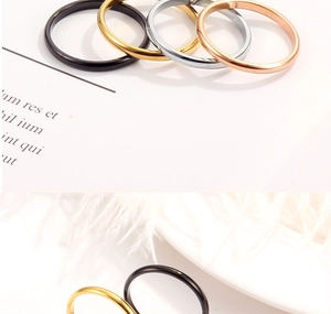 Detailed set of minimalist polished stainless steel rings in black gold silver and rose gold