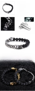 Detailed view of men's skull bracelet featuring black volcanic stone and stainless steel links
