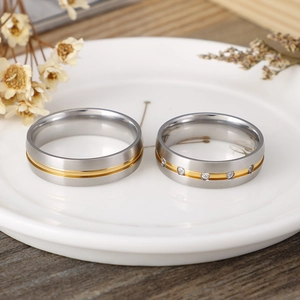Titanium steel brushed couple rings with rose gold accents and sparkling cubic zirconia