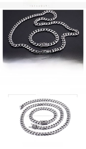Macro detail of CZ zircon stone setting on stainless steel cuban link chain set