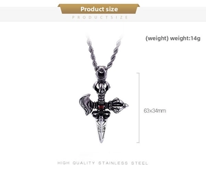 Detail of cross vajra pendant with red zircon inlay in vintage stainless steel