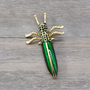 Baroque style green enamel grasshopper brooch with sparkling crystals and gold metal finish