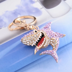 Golden shark keychain with purple rhinestones and crystal accents for bags or car keys