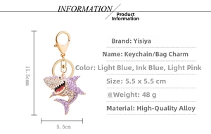 Detailed view of the diamond-encrusted shark keychain with precise size measurements
