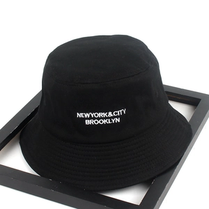 Versatile black canvas bucket hat with white New York embroidery for outdoor sun protection