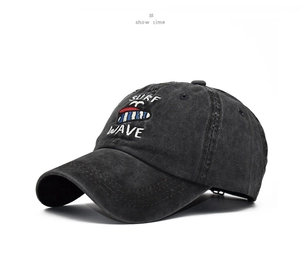 Close-up of charcoal black washed cotton baseball cap with Surf Wave embroidery detail