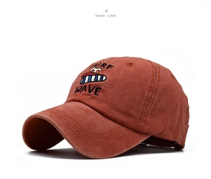 Detail showing the retro red washed cotton baseball cap with Surf Wave embroidery