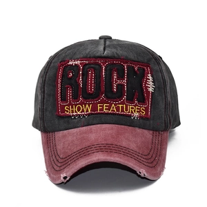 Washed cotton baseball cap in black and red with ROCK embroidery and distressed details