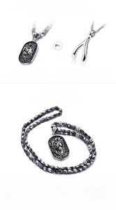 Detail of 316L stainless steel lion head pendant with polished finish on bead chain