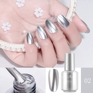 Detail of silver mirror nail polish showing application and brush on metallic finish