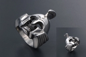 Macro view of vintage Spartan helmet steel ring with detailed skull mask and metallic shine