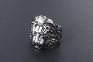 Macro shot of punk style lion head ring featuring detailed vintage steel carvings