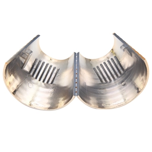 Detailed close-up of a silver grooved ponytail cuff with a reflective metallic finish