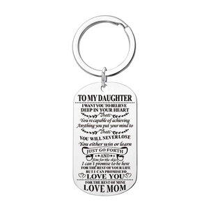 Detailed view of silver military tag pendant with motivational message from mom to daughter