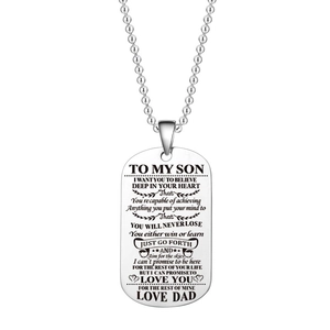 Macro detail of engraved titanium steel dog tag pendant with father to son message