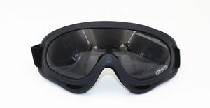 Detail view of polarized ski goggles with dark lenses and adjustable elastic headband