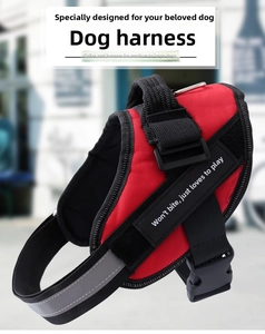 Detail view of red heavy duty dog harness with sturdy handle and reflective safety strips