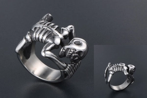 Macro shot of gothic titanium steel skull ring with intricate skeletal textures