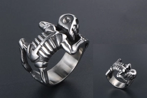 Macro shot of gothic punk skull skeleton ring with detailed silver steel bone textures
