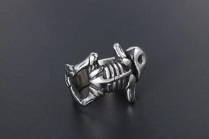Macro detail of gothic skull skeleton ring in vintage silver finish with 3D bone textures