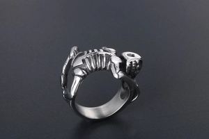 Detailed view of skull skeleton wrap around ring in antique silver stainless steel