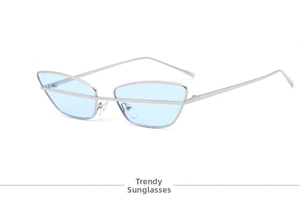 Detail of silver cat-eye sunglasses with light blue lenses and a stylish metal bridge