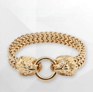 Detail of 316L stainless steel bracelet with dual golden lion heads biting a round ring