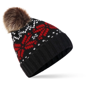 Détail d'un bonnet en tricot d'hiver avec motif flocon nordique et pompon marron doux