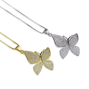 Elegant gold and silver butterfly necklaces with sparkling cubic zirconia on a white background
