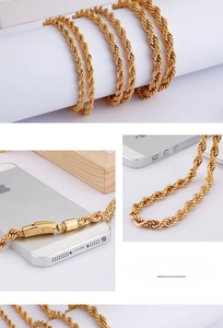 Detail shot of golden fine steel rope chain with secure cylindrical plug-in clasp