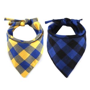 Detail of plaid cotton pet bandanas in yellow and blue checkered patterns with soft texture