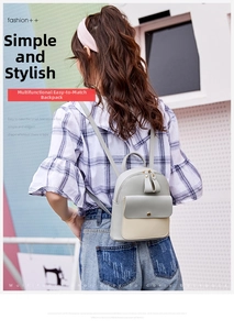 Mini gray and beige contrast backpack shown on a model for size and fit reference