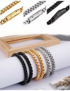 Detail view of 6mm square box chains in gold, steel, and black with secure plug buckles