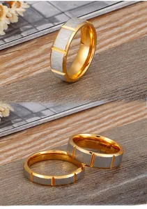 Detail of two-tone stainless steel rings with brushed silver finish and gold polished edges