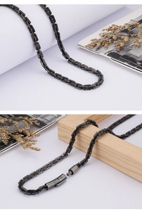 Macro view of vintage 304 stainless steel rectangular link chain with cylindrical clasp