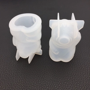 Detailed view of heart-shaped and 3D pig silicone molds for DIY crystal epoxy and candles