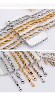 Detailed close-up of two-tone braided twist chain necklaces with lobster clasp closures