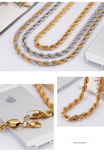 Detailed macro view of two-tone braided twist rope chain with secure lobster clasp closure