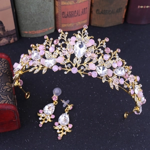 Detailed view of Baroque bridal tiara and earrings set with pink beads and crystals