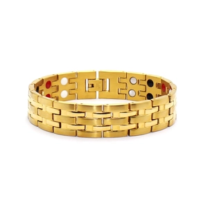 Detailed macro view of 15mm gold stainless steel bracelet with magnetic therapy stones
