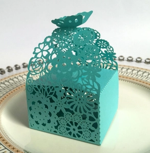 Tiffany blue laser-cut candy box with elegant floral patterns and butterfly top closure